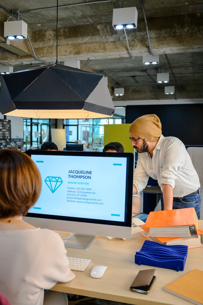 Mastering the First Impression: Your intriguing post title goes here Team collaborating in a modern office with a focus on creative solutions and business development.